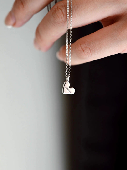 Irregular Heart-Shaped Sterling Silver Necklace with "Peace" Engraving