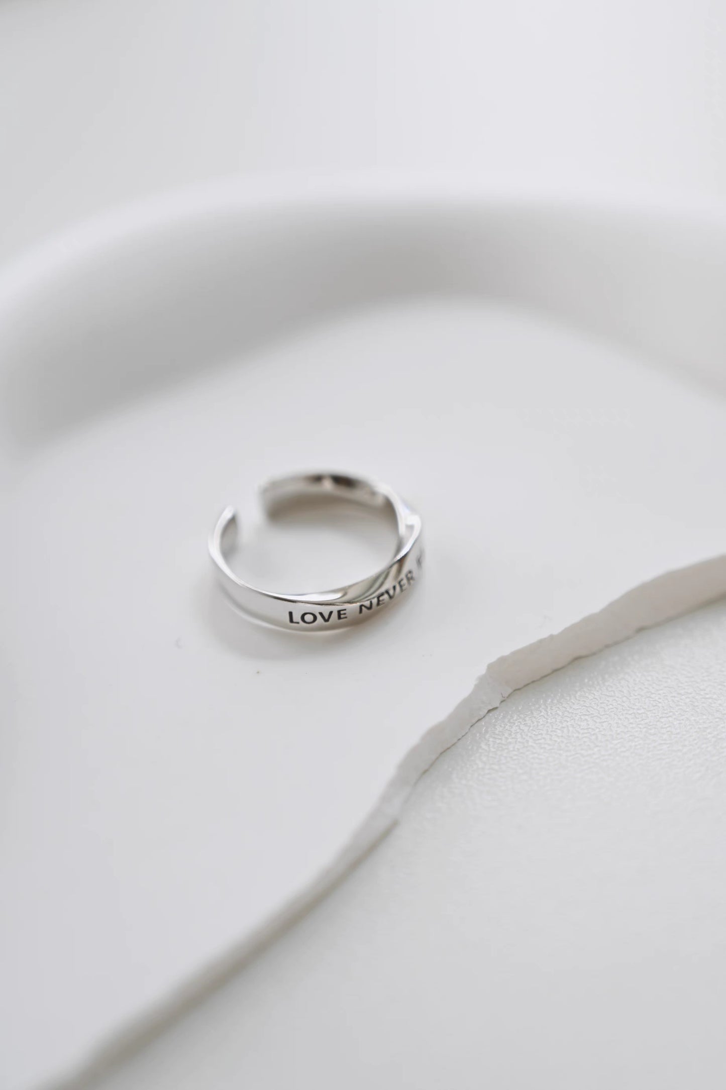 LOVE NEVER FAILS Silver-Plated Platinum Ring – Unique Design