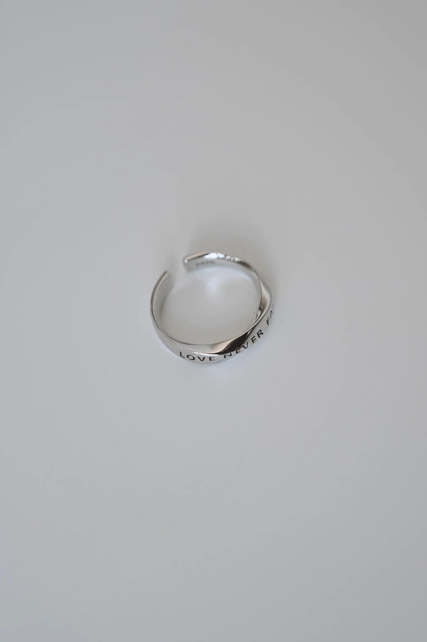 LOVE NEVER FAILS Silver-Plated Platinum Ring – Unique Design