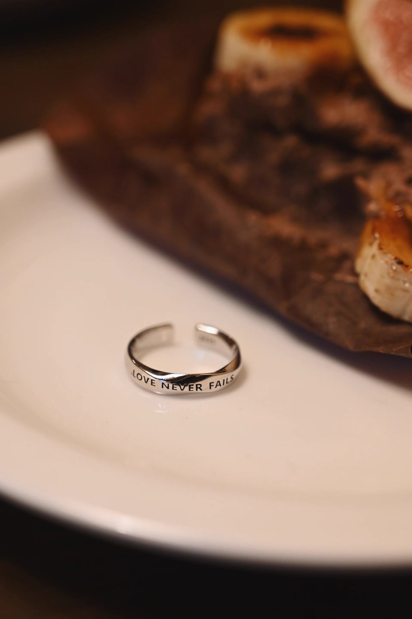 LOVE NEVER FAILS Silver-Plated Platinum Ring – Unique Design